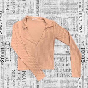 Beige deep V collared long sleeve top with zipper detail,